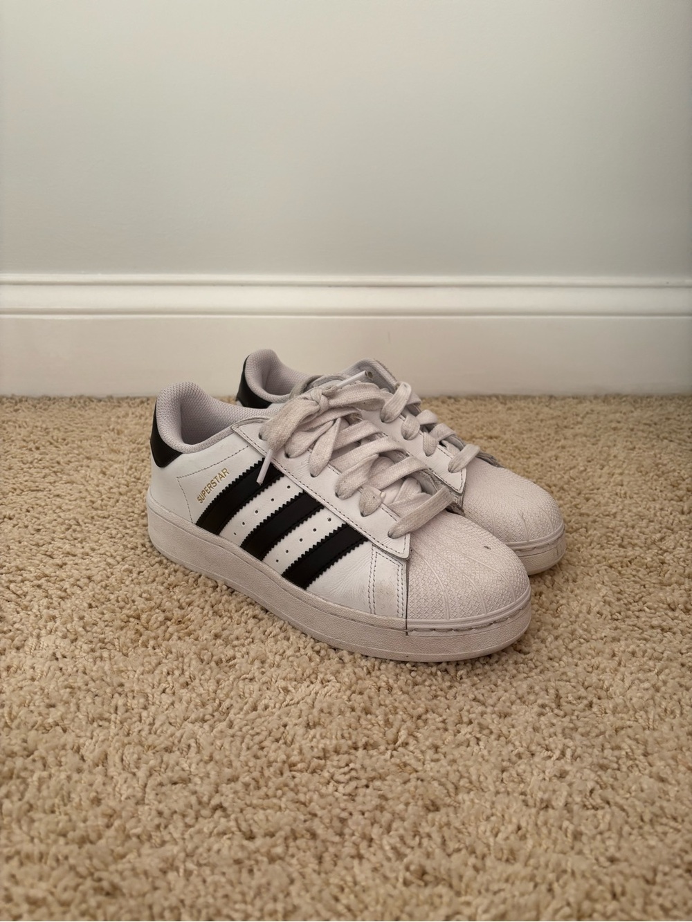 White Adidas Superstars